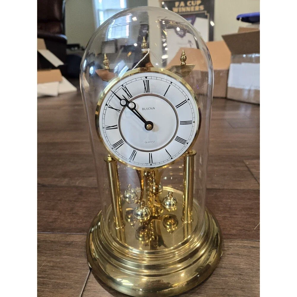 Bulova Tristan I B8818 Anniversary Clock - Glass Dome, Rotating Crystal Pendulum